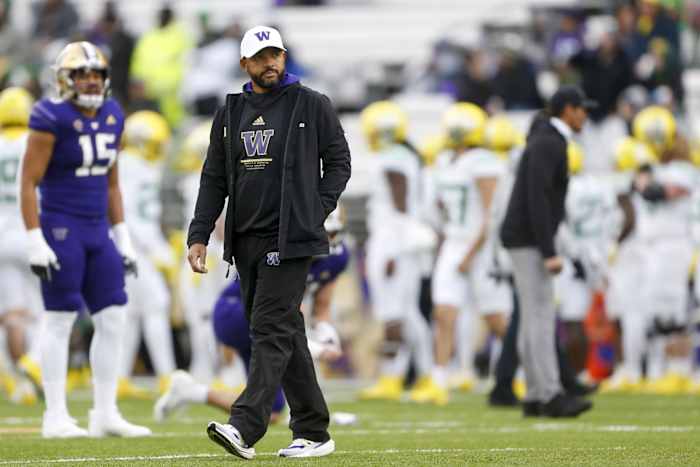 Nov 6, 2021; Seattle, Washington, USA; Washington Huskies head coach Jimmy Lake watches pregame warmups against the Oregon Ducks at Alaska Airlines Field at Husky Stadium.